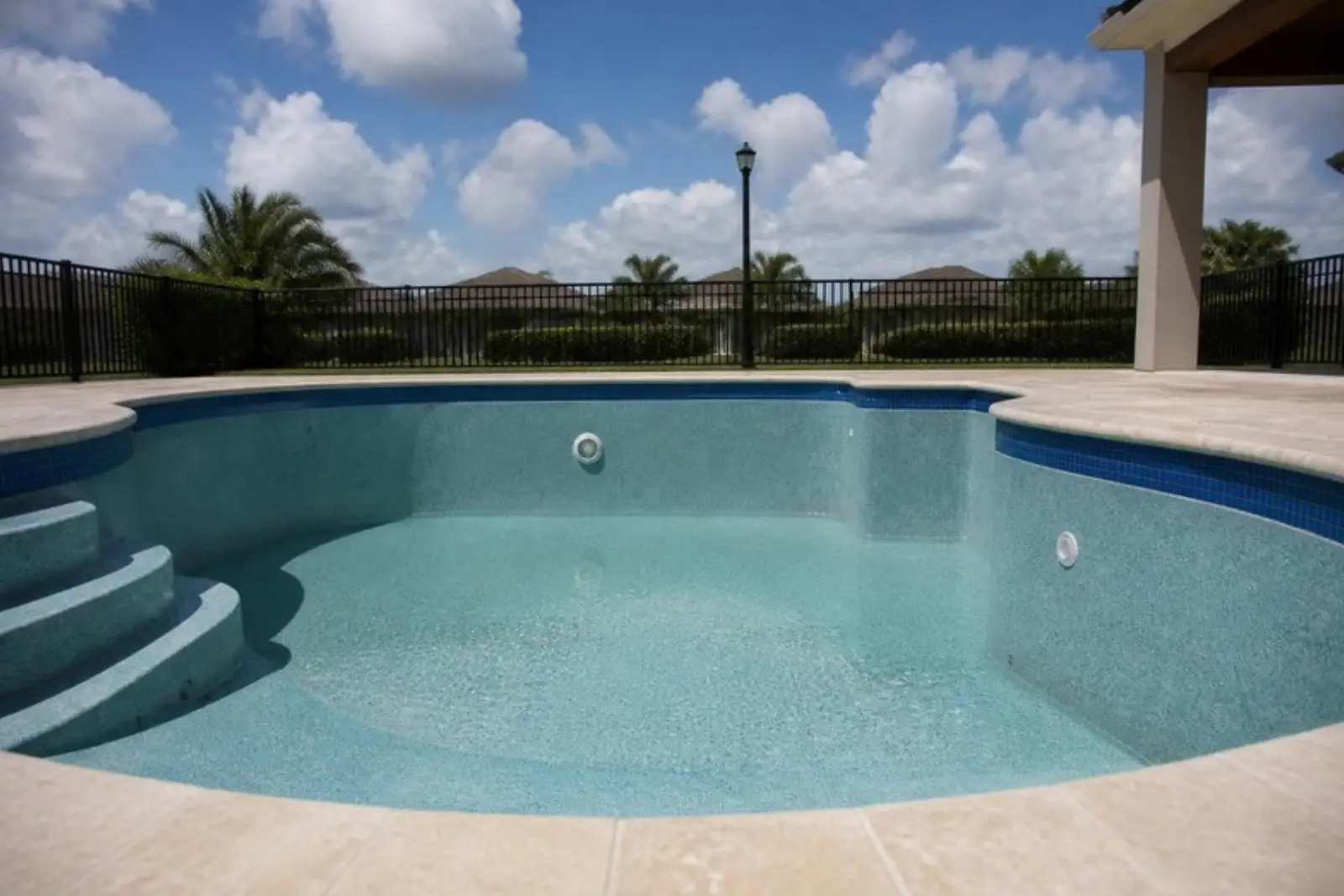 Freshly resurfaced pool with new tile